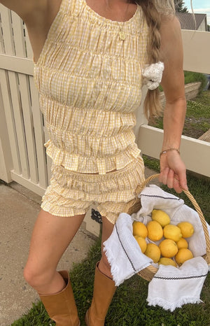 Beginning Boutique Tango Yellow Top yellow and white gingham shirred tank top with a ruffled hem