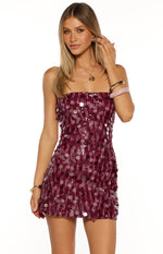 Purple strapless mini dress covered in shimmering, round disc sequins creating a textured, party-ready finish