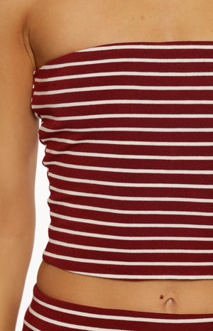 Close-up of the ribbed knit fabric of the burgundy and white striped tube top showing texture and pattern