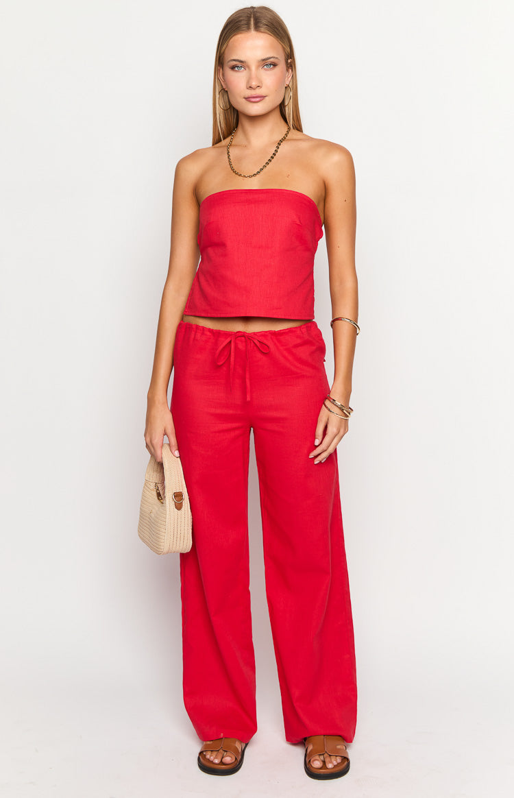 Full length view of red wide-leg pants with a drawstring waist and relaxed fit