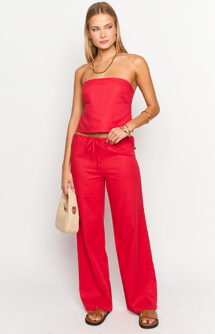 Full length red wide-leg pants with a relaxed fit and a visible drawstring waist