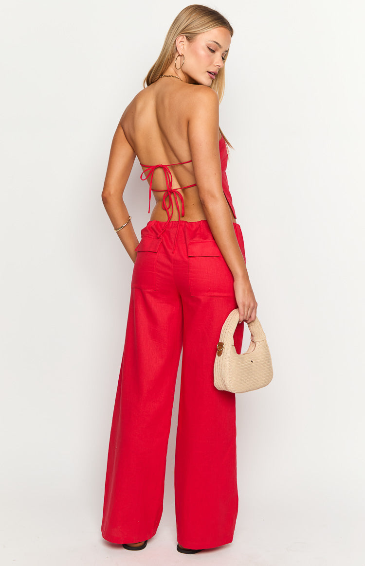 Rear view of red wide-leg pants with an elasticated waist and two flap pockets