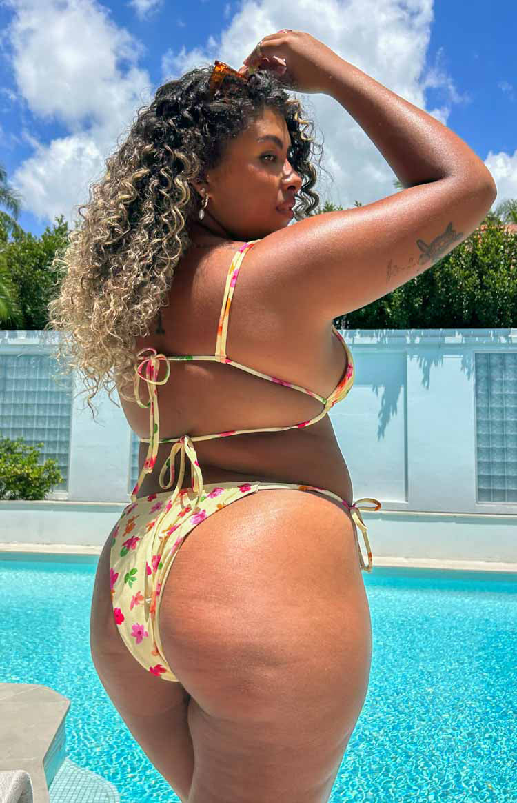 Back view of the yellow floral bikini bottom with adjustable side ties