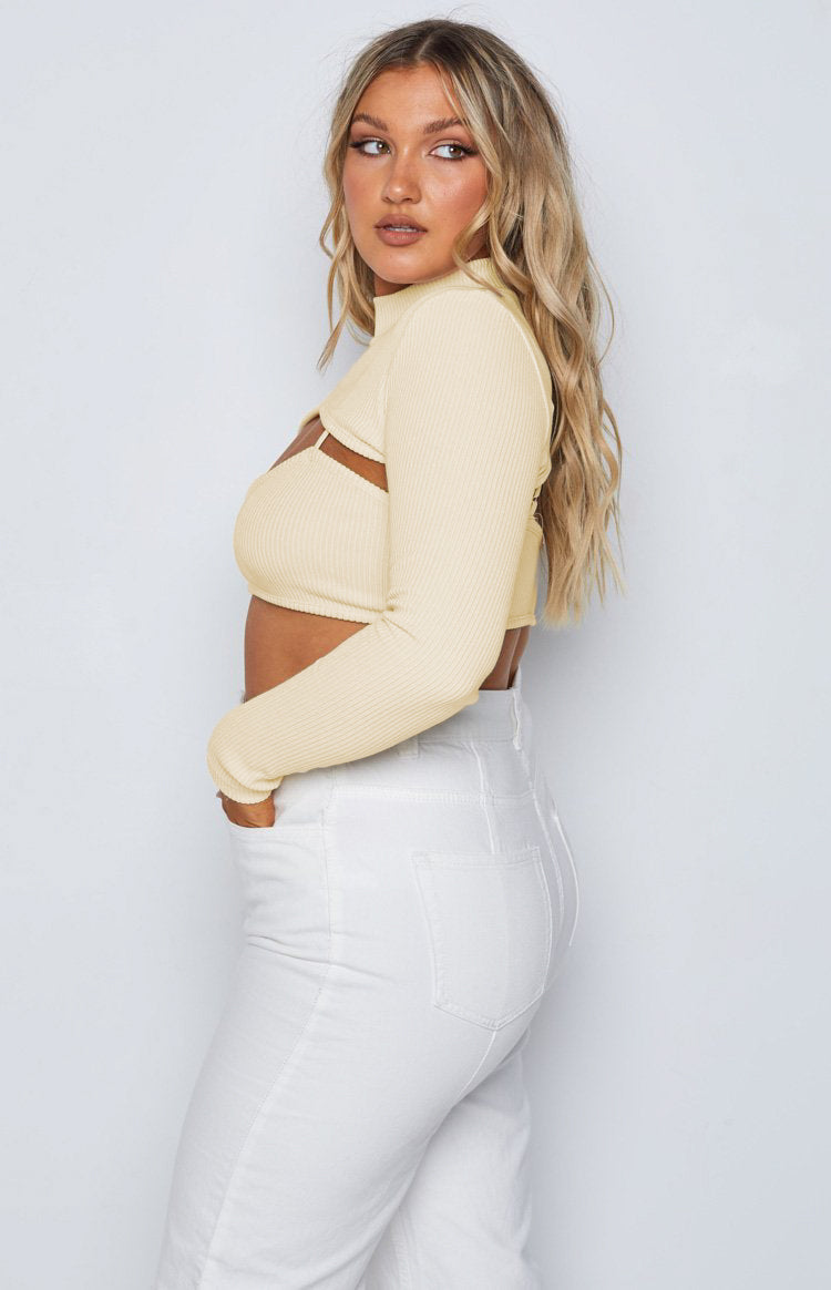 Cream ribbed knit high neck long sleeve cropped shrug with matching bralette and front cutouts