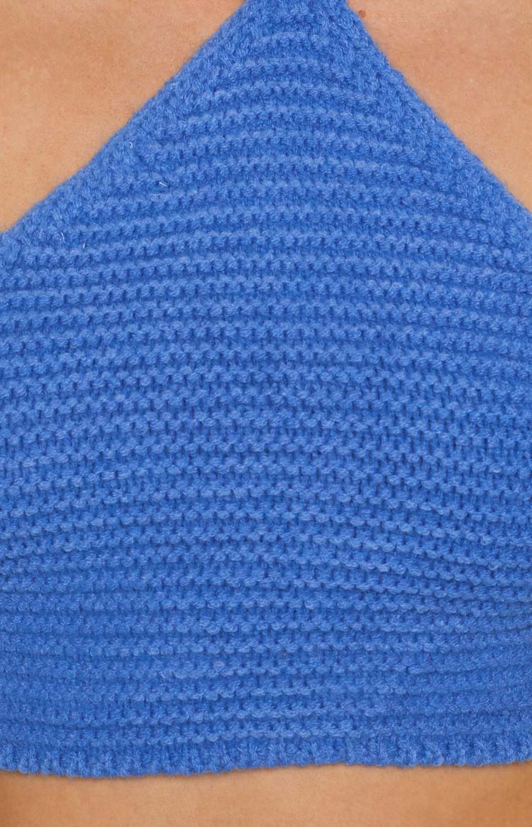 Blue crochet top featuring a tight, textured knit pattern