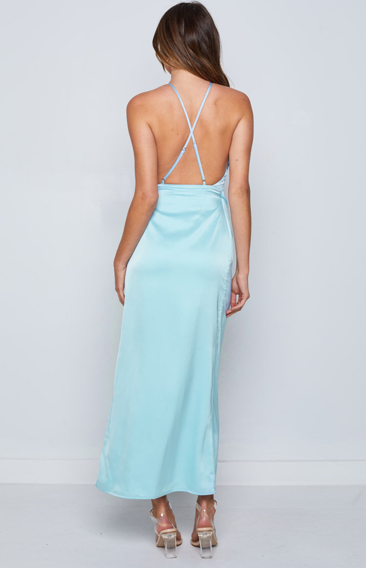 Rear view of the blue satin maxi dress showing criss-cross spaghetti straps, a low scoop back, and a subtle side slit