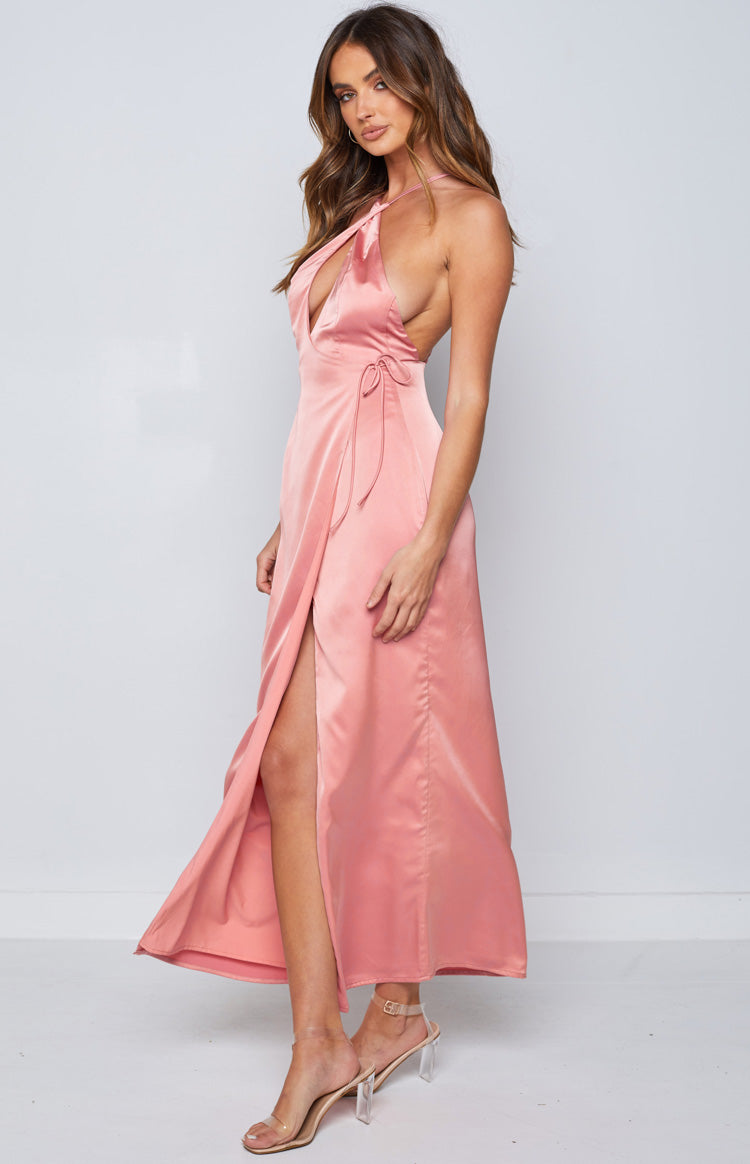 Side view of a rose pink satin maxi dress with a deep V-neck halter, wrap front, and high leg slit