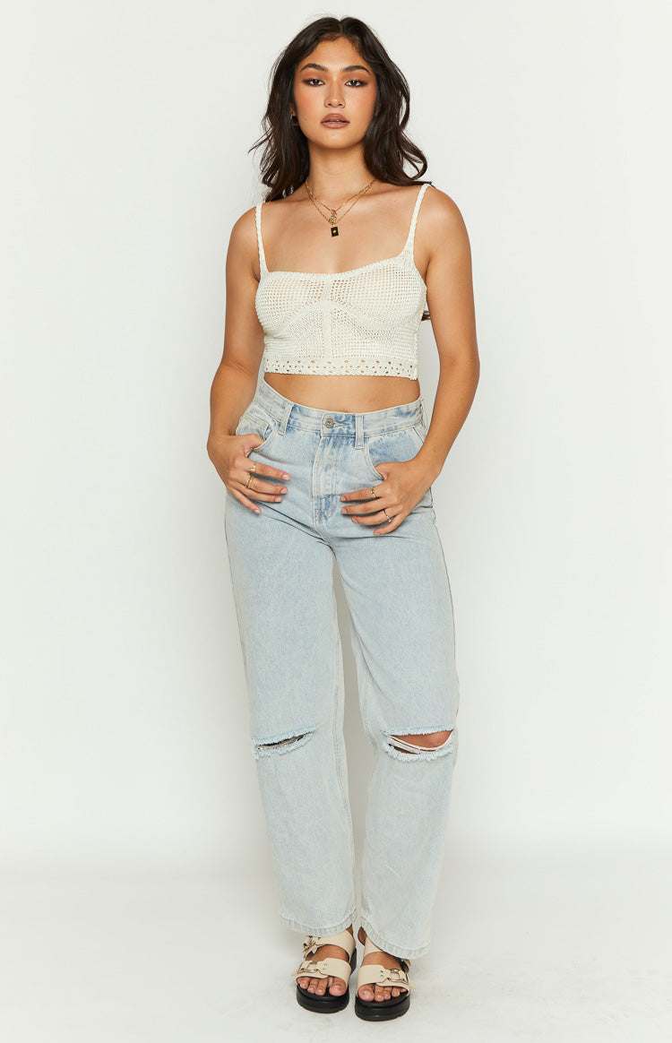 Cream crochet crop top with thin spaghetti straps, a straight neckline, and textured diamond knit details on the bust
