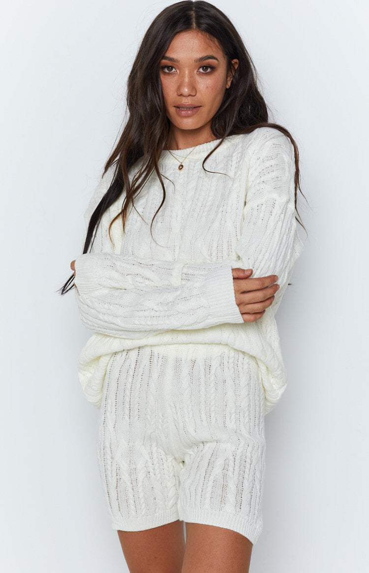 Cream cable knit shorts with a relaxed fit and intricate textured pattern