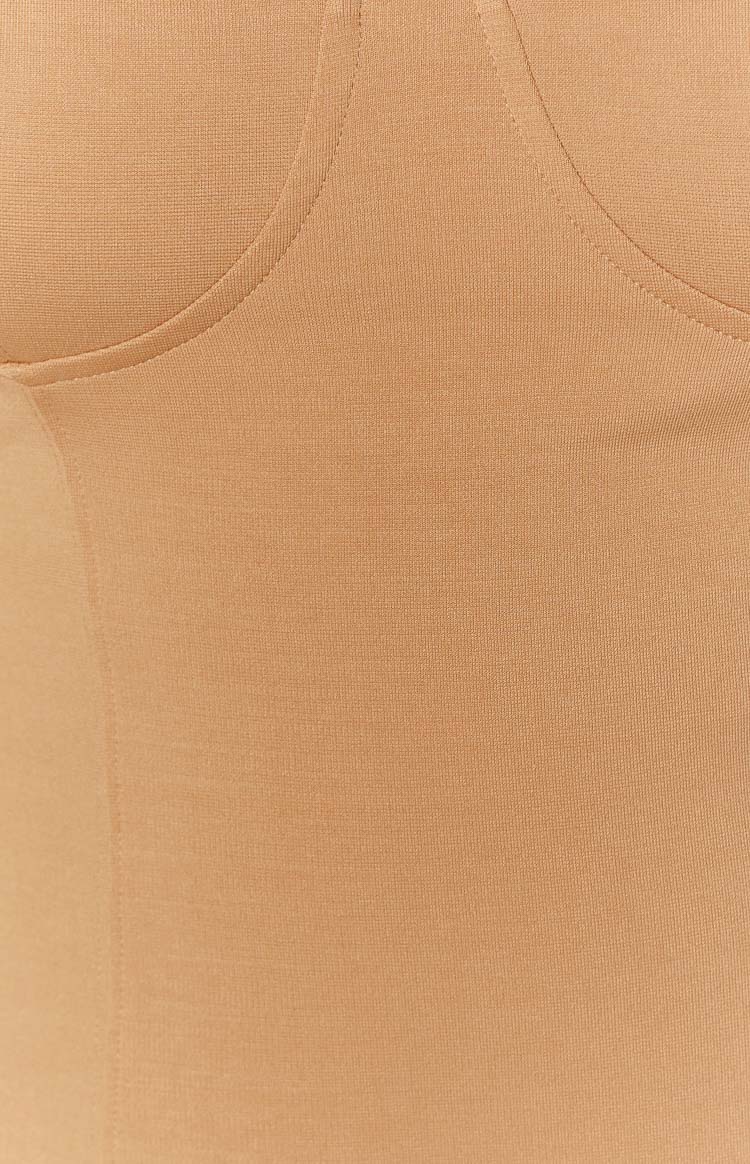 Close-up of the structured bust cups with visible seam lines and ribbed knit texture on the brown mini dress