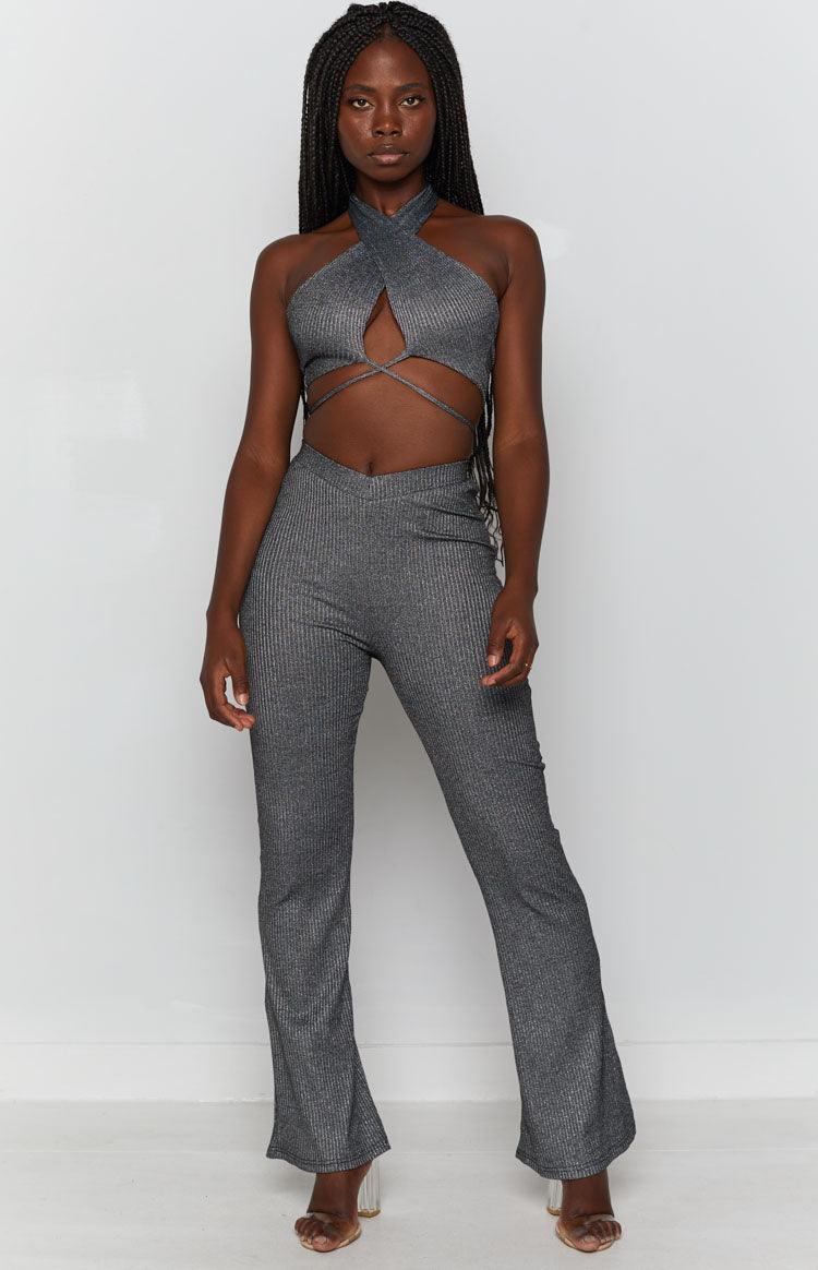 Black ribbed shimmer pants with a V-shaped waistband and flared leg