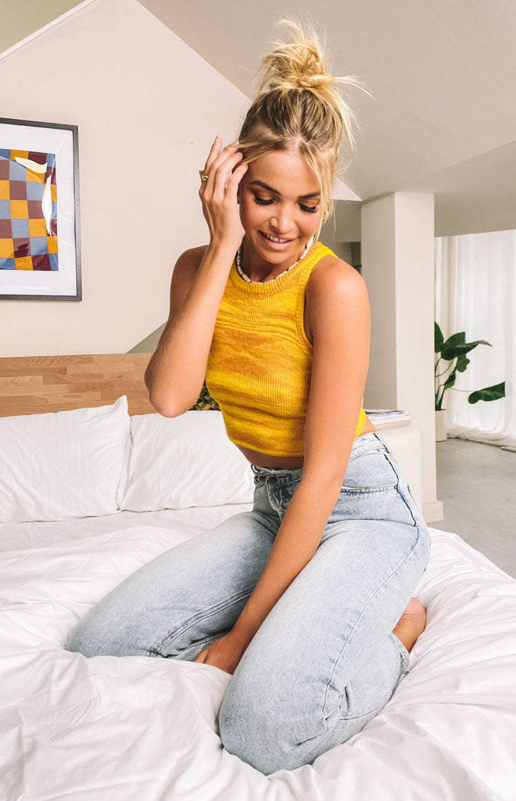 Yellow ribbed knit tank top with subtle horizontal stripe texture and round neckline