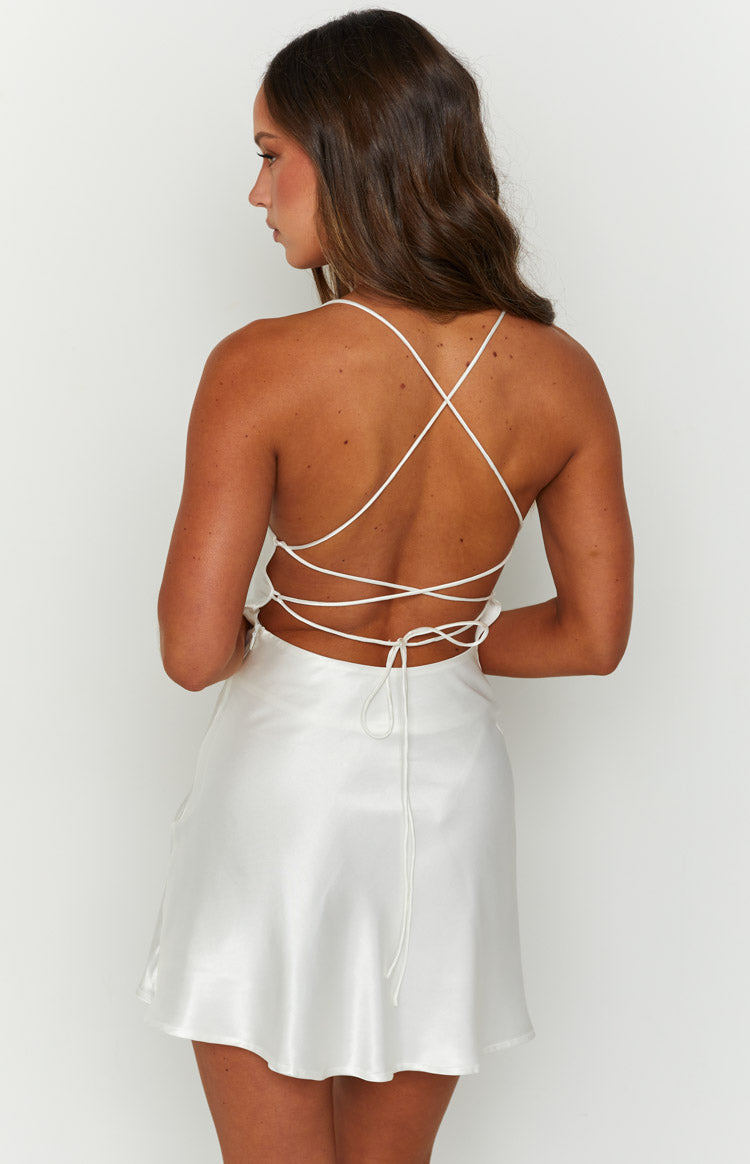 Back view of a white satin mini dress with delicate criss-cross back straps and a tie closure