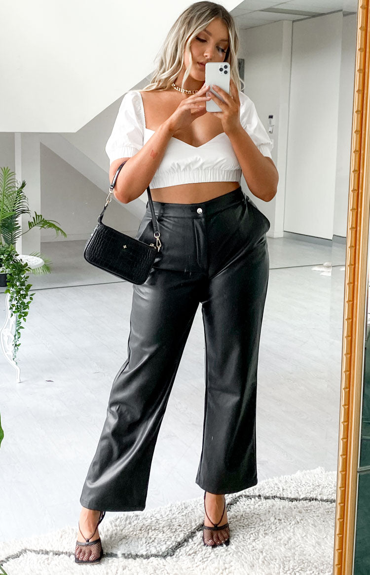 Black PU high-waisted wide-leg pants with a relaxed fit and ankle length