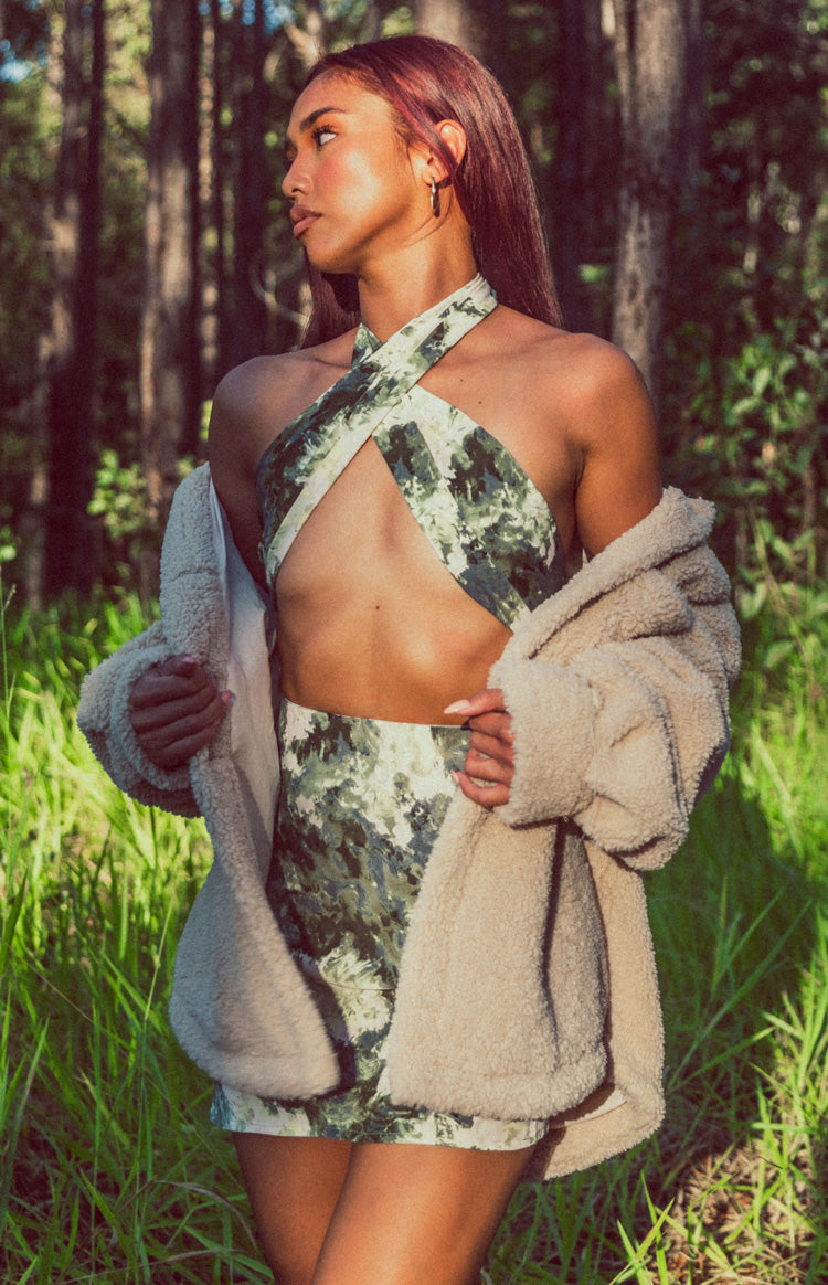 Criss-cross halter neck scarf top in multi-tone green abstract print with a matching bodycon mini skirt