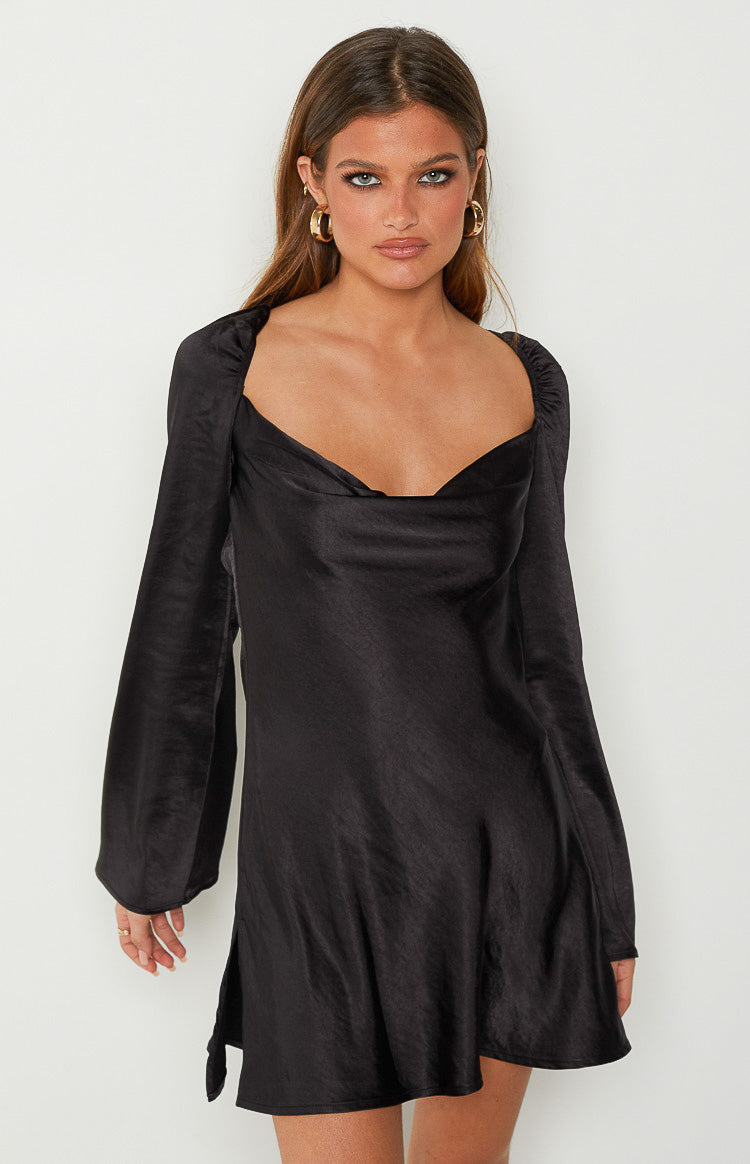 Black satin mini dress with a draped cowl neck, long puff sleeves, and a subtle side slit