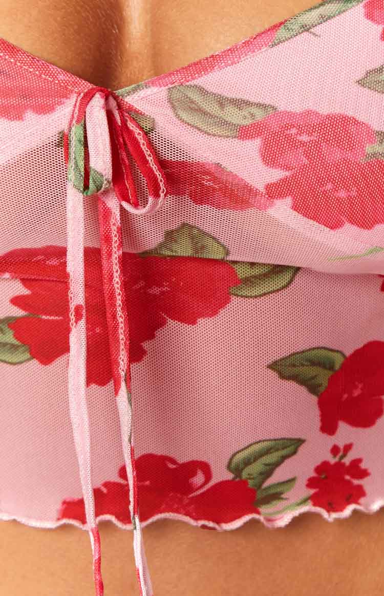 Close-up of the pink floral mesh cami showing the tie-front neckline and lettuce edge hem