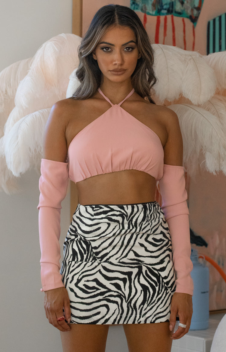 Pink halter neck crop top with a gathered elasticated hem and matching detached long sleeves