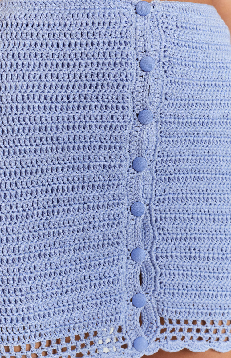 Blue crochet knit mini skirt with a button-front placket and a decorative openwork scalloped hem
