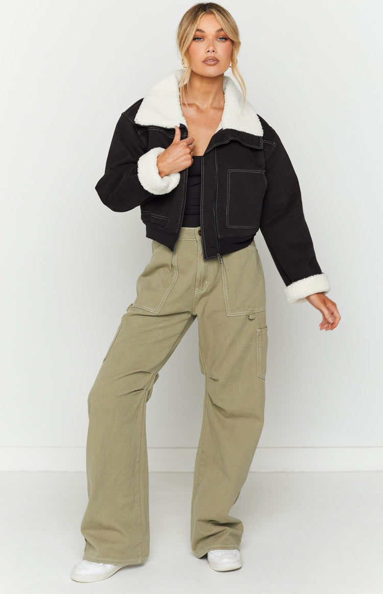 Black denim cropped jacket with white sherpa collar and cuffs, open front showing white contrast stitching
