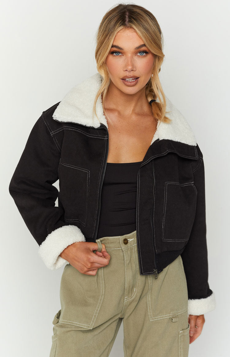 Cropped black denim sherpa jacket with white sherpa collar, cuffs, and contrast stitching