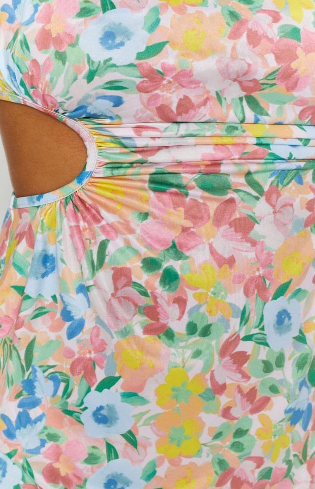 Multi-coloured pastel floral dress with a side cutout and ruched fabric detail