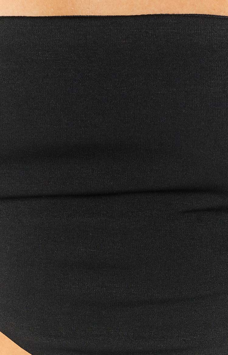Close-up of the black fine knit fabric of the bandana top with a subtle horizontal fold