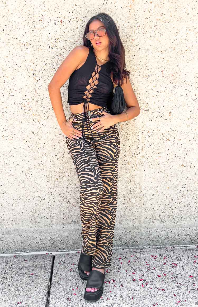 Brown and black zebra print pants with a high waist and straight leg fit