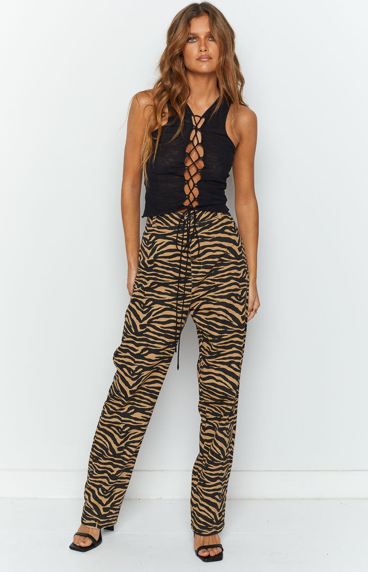 Beginning Boutique Kennedi Brown Print Pants brown and black zebra print high-waisted straight-leg pants with a drawstring waist