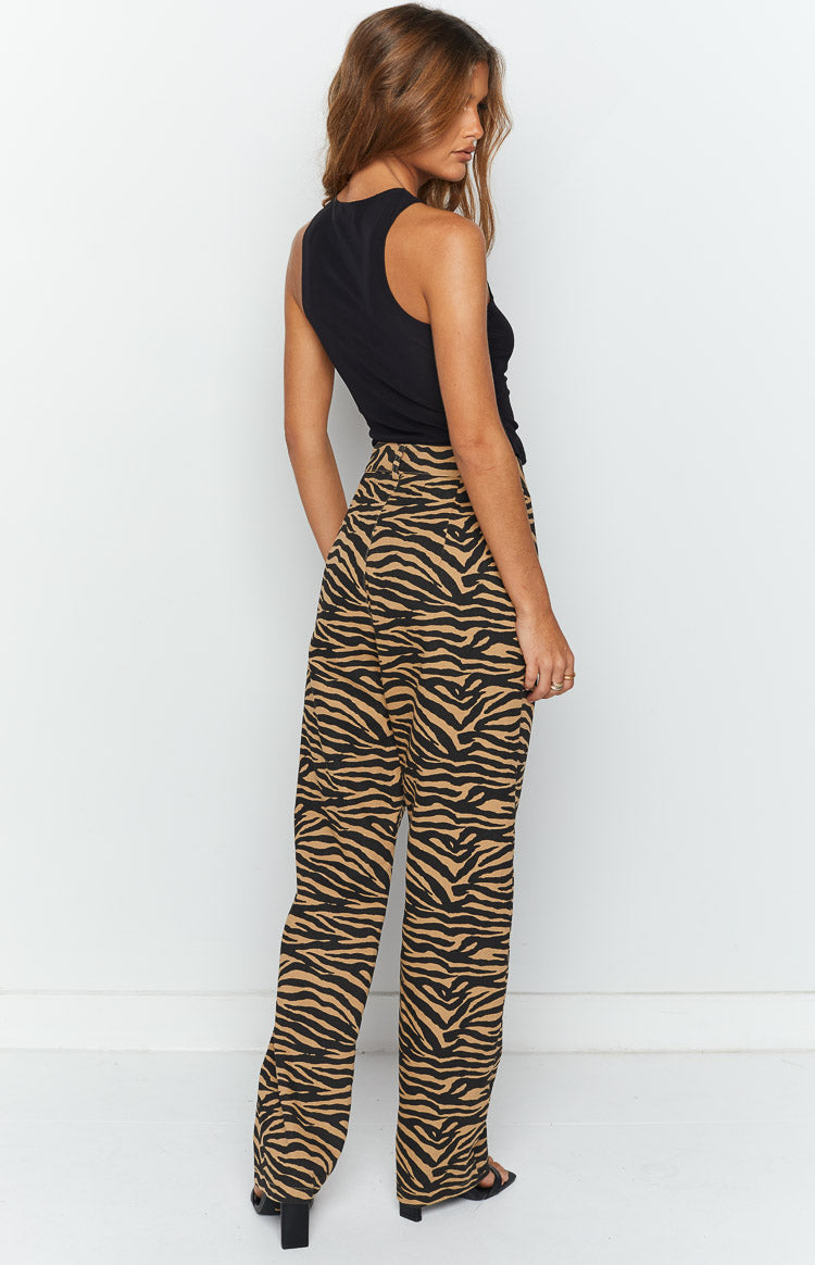 Rear-side view of brown and black zebra print wide-leg pants with a high waist