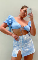 Sky blue and white cloud tie-dye denim mini skirt with a high left thigh slit