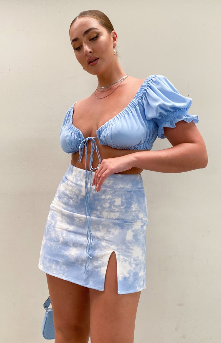 Light blue and white tie-dye denim mini skirt with a high left thigh slit