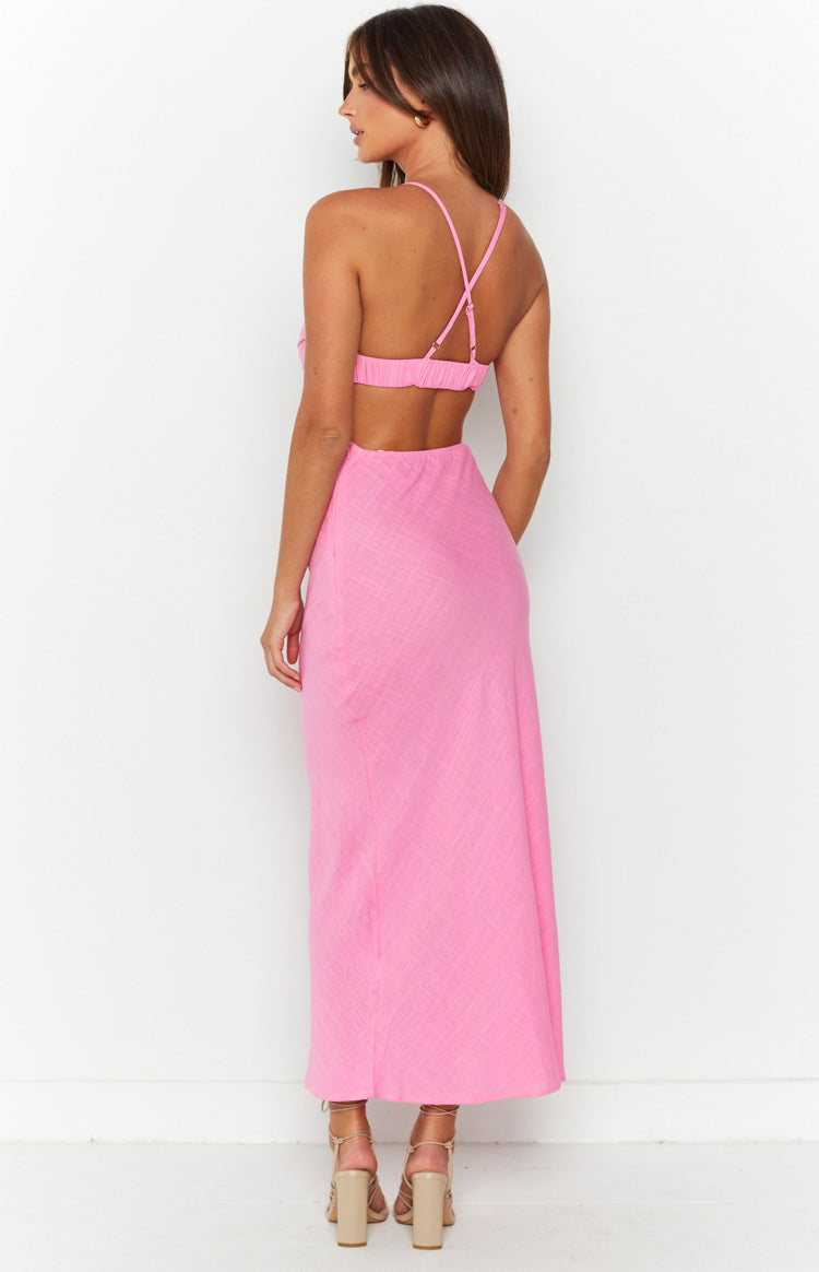 Rear view of a pink maxi dress showing criss-cross adjustable spaghetti straps, elasticated back, and waist cutout