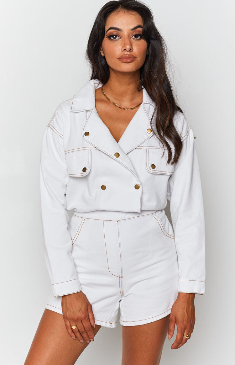 Cream Lizzo Denim Jumpsuit featuring a double-breasted collared top, long sleeves, short legs, and contrast stitching