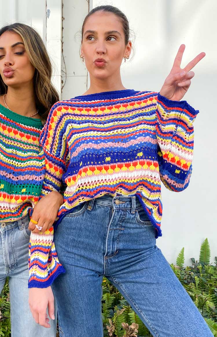 Textured blue and multi-coloured striped open knit sweater with a wide boat neck and dropped long sleeves