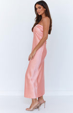 Side view of a pink satin strapless maxi dress with a relaxed fit and flowy drape