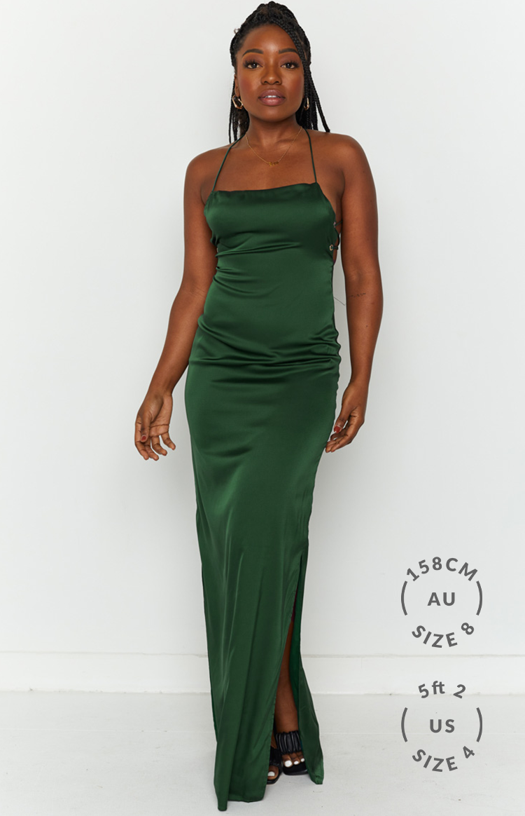 Emerald green satin maxi dress with square neckline, thin straps, and side lace-up detail