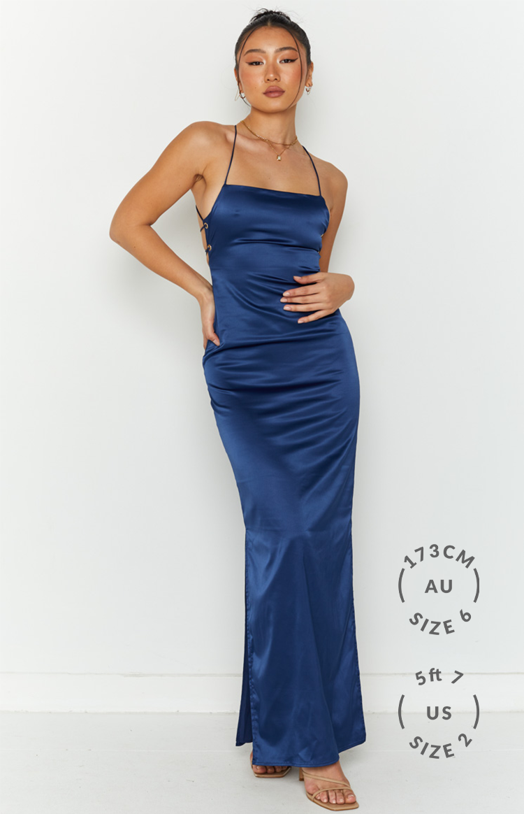 Navy satin maxi slip dress with a square neckline, thin spaghetti straps, and side lace-up detail