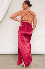 Wine satin formal dress with a low open back, criss-cross straps, tie detail, and a high side slit