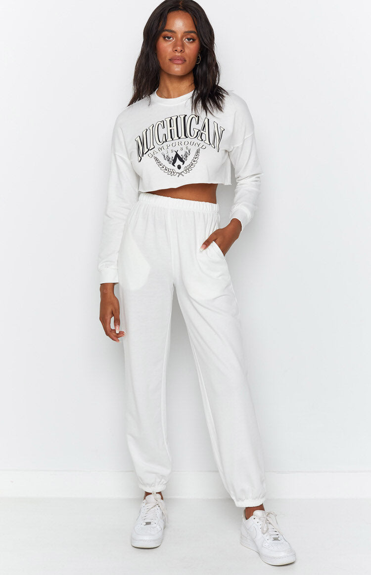 White Michigan Camp Two Piece Lounge Set with a cropped crewneck sweatshirt featuring a dark graphic print and elasticated joggers