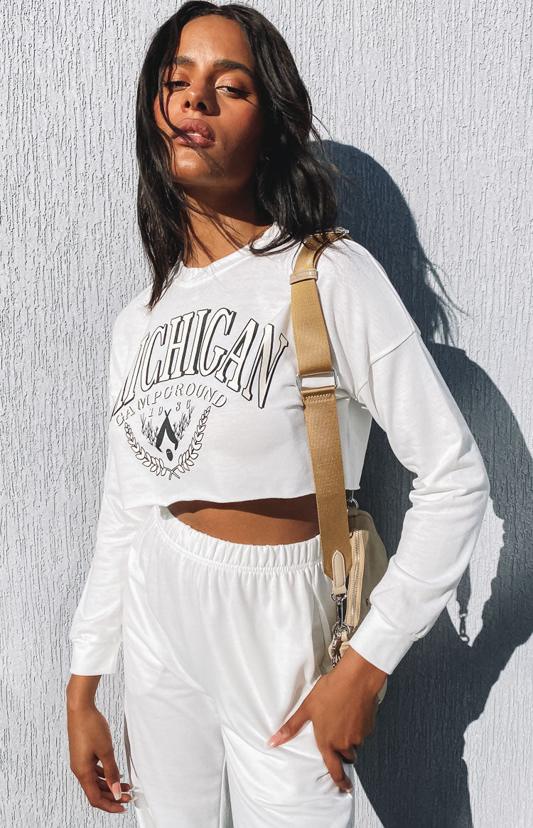 White cropped long sleeve top with Michigan Campground graphic print and lounge pants with elasticated waist
