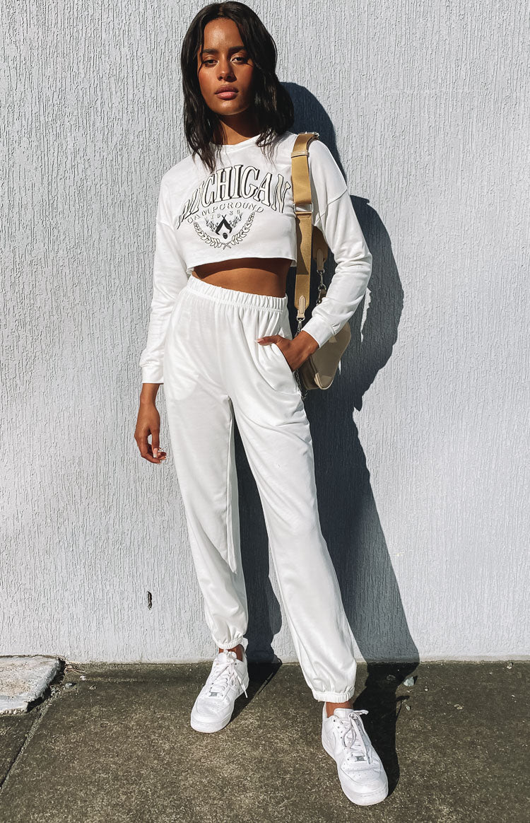 White cropped long sleeve sweatshirt with black Michigan graphic and matching high-waisted jersey joggers