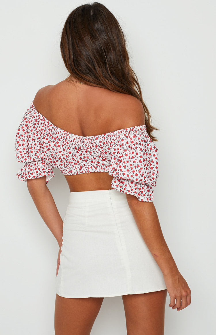 White textured mini skirt with a visible back zipper closure and straight fit