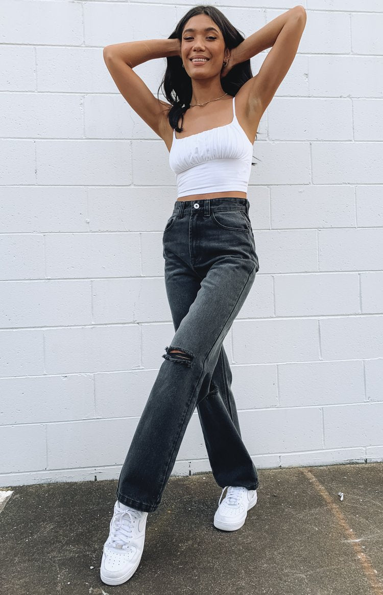 Charcoal wide leg denim jeans with a high waist and distressed knee