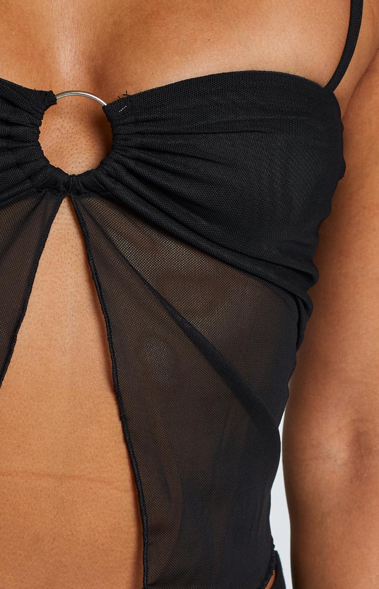 Close-up of the black cami's silver O-ring, ruched bust, and sheer mesh cutouts