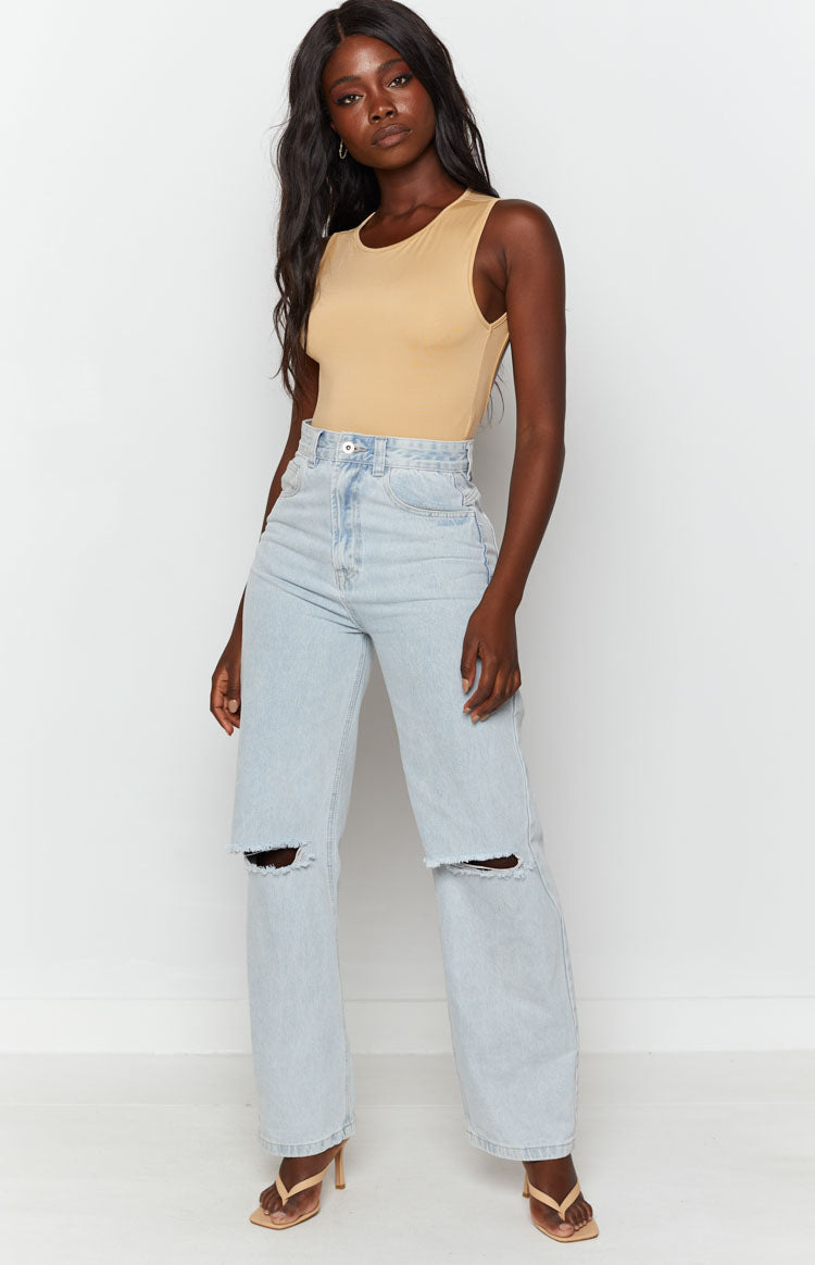 Beige jersey bodysuit with a crew neck and sleeveless design, form-fitting