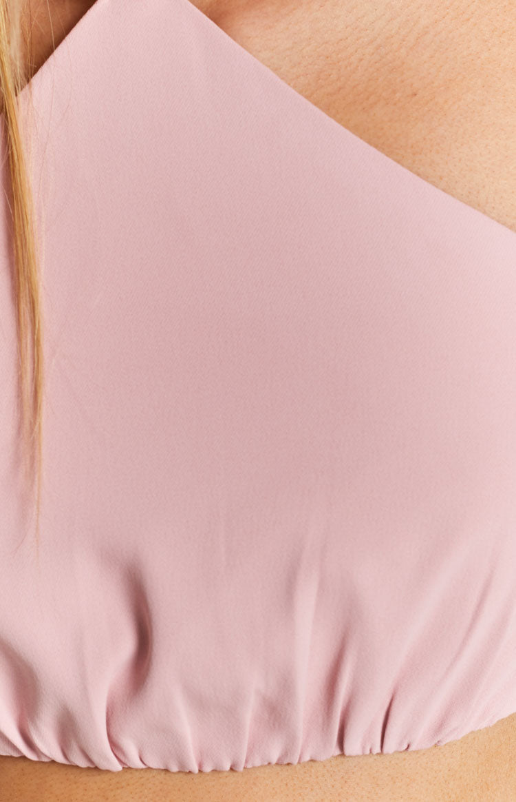Light pink fitted top with a subtle textured fabric and gathered elasticated hem