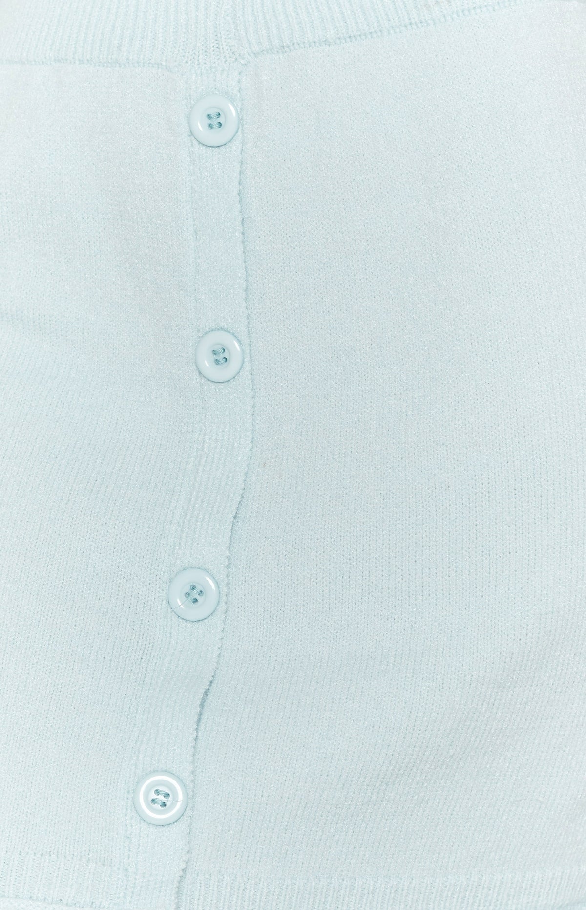Soft light blue knit skirt fabric with a vertical row of four round matching buttons