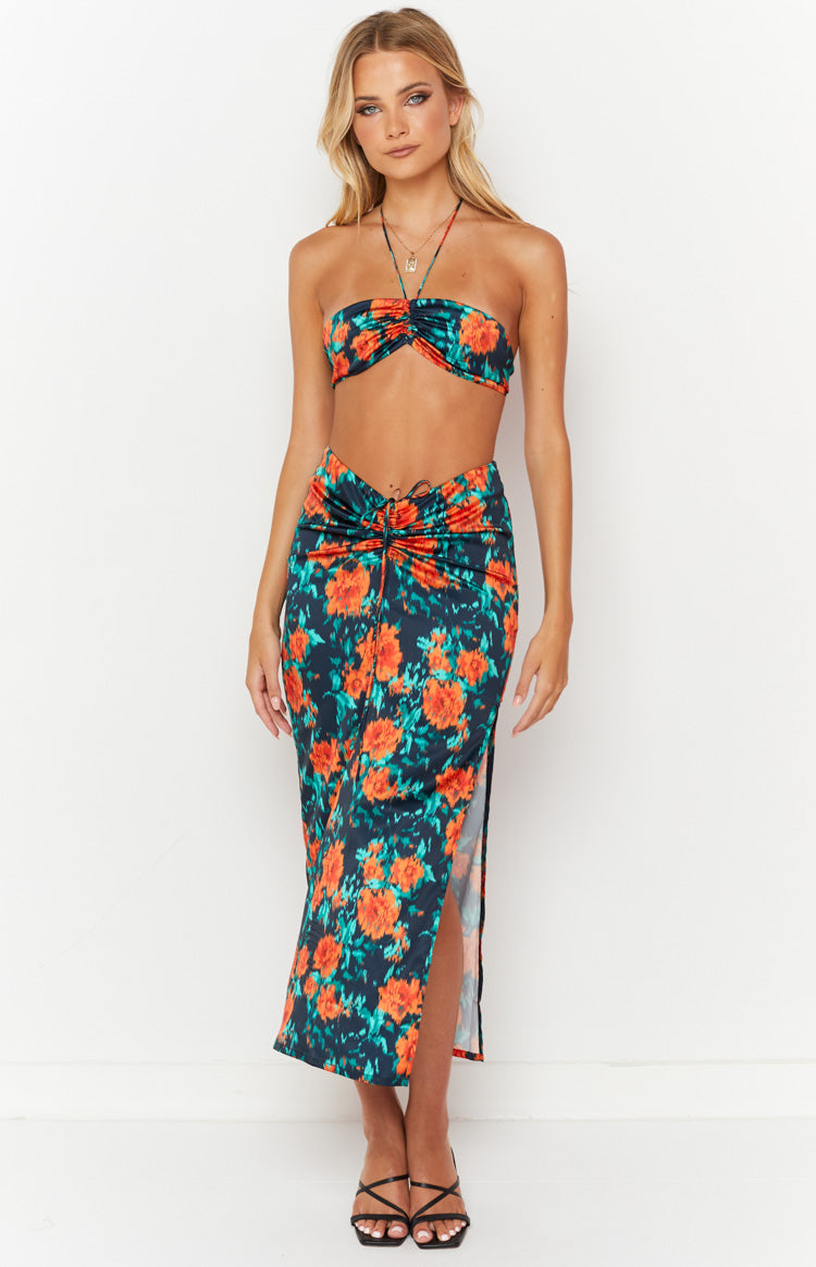 Beginning Boutique Rani Red Floral Maxi Skirt dark floral maxi skirt with orange and teal flowers, ruched front and side slit