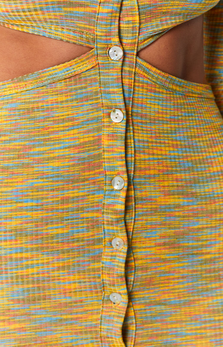 Yellow, blue, and orange space dye ribbed knit mini dress with side waist cutouts and a front placket of white shell buttons
